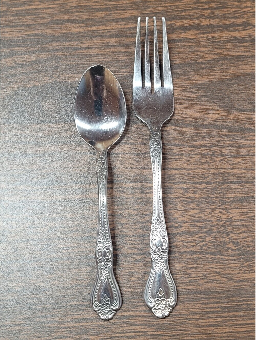Vintage Stainless Steel Spoon and Fork Set with Ornate Floral Handles